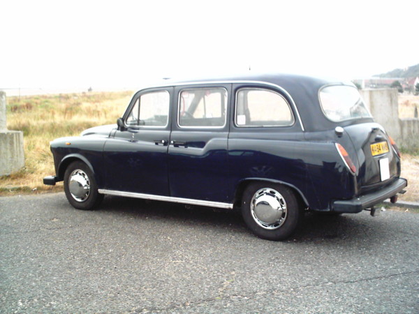 Chromed hub caps on a london taxi