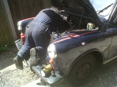 The bonnet opens wide to allow easy access to the engine.